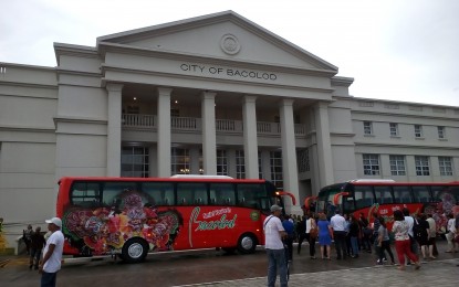 <p><strong>'MUST-EXPERIENCE'.</strong> The facade of the Bacolod City Government Center located along the Circumferential Road. Parked in front of the structure are the city’s two tourism buses. <em>(Photo by Nanette L. Guadalquiver)</em></p>